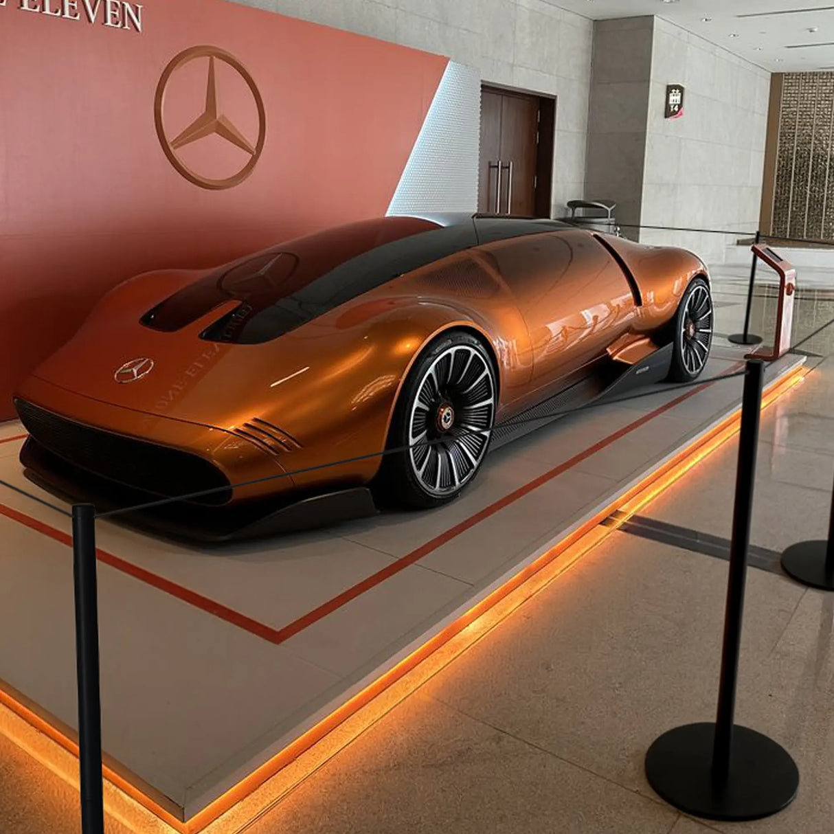 Low Profile Cord Barrier System in a showroom with a Mercedes-Benz concept car.