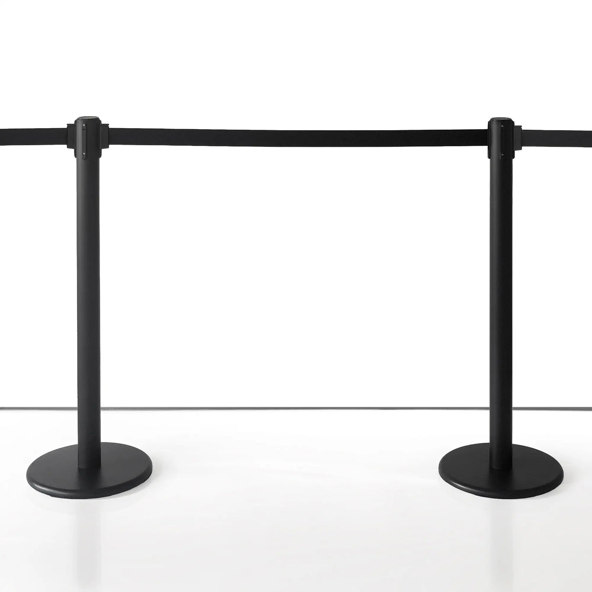 4 Way Black Stanchion with Retractable Rope in a Museum with white background setting
